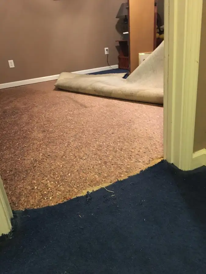 Carpet pad removal revealing water damage during Water Mitigation Services in Ephrata